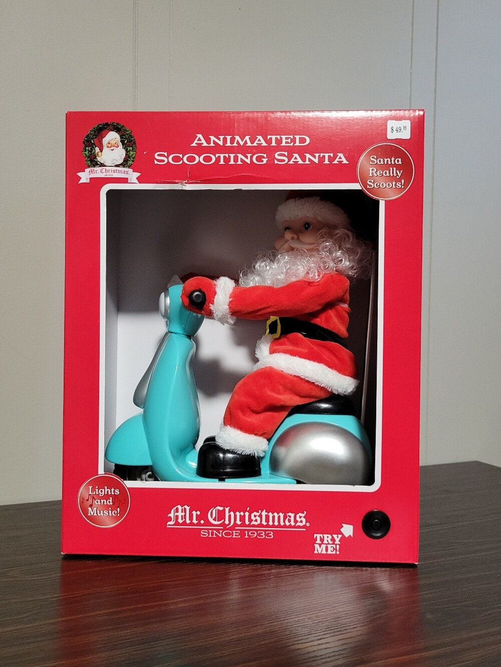 Mr. Christmas Animated Scooting Santa Lights Music Plays 24 Songs NIB 13"